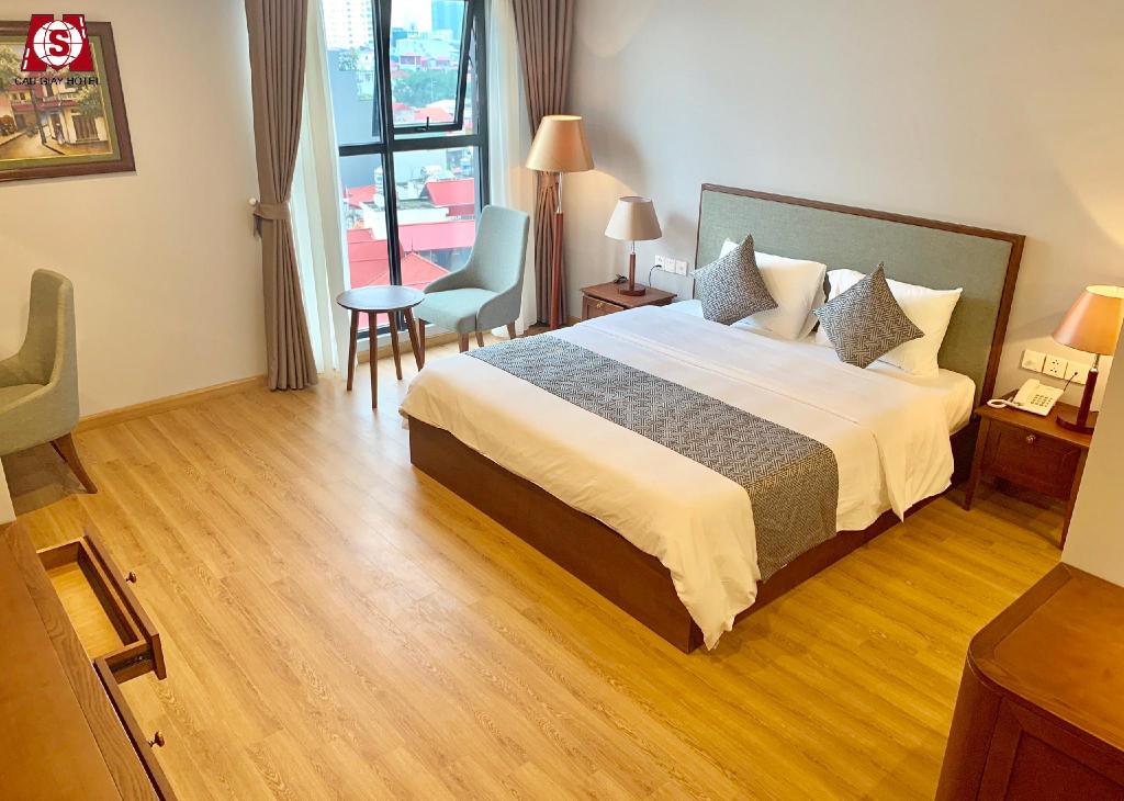 Phòng ngủ tiêu chuẩn tại Capital Cau Giay Hotel - tiện nghi và sạch sẽ
