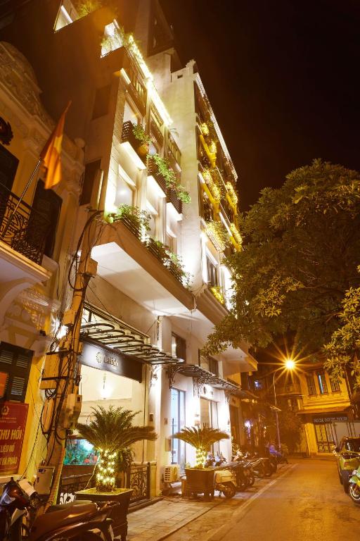 Review khách sạn Ha Noi Calido Hotel – GetGo Vietnam 4 Phòng ngủ tại Ha Noi Calido Hotel với giường đôi lớn