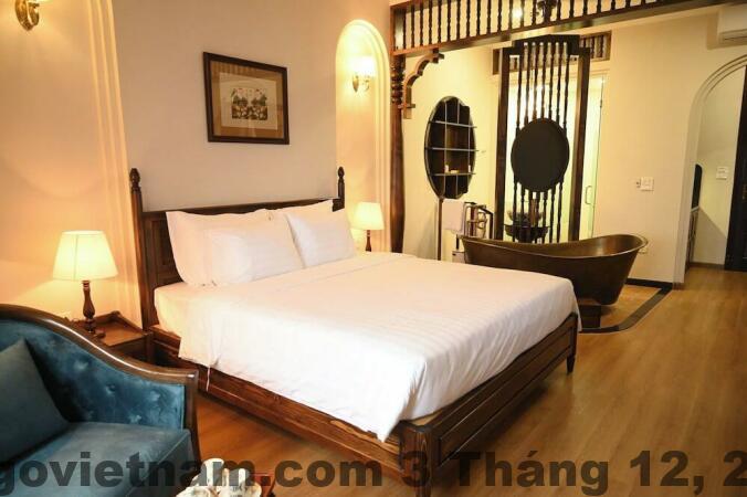 Phòng ngủ khách sạn La Belle Maison Hà Nội với decor boutique nhẹ nhàng