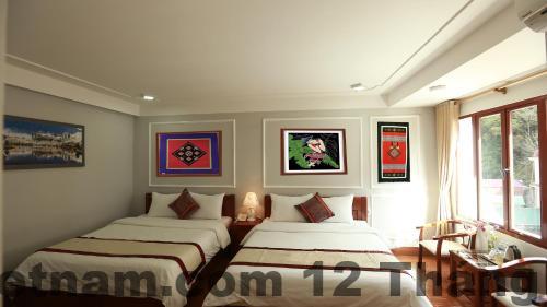 Phòng nghỉ tiêu chuẩn tại SAPA LAND HOTEL với nội thất gỗ đơn giản