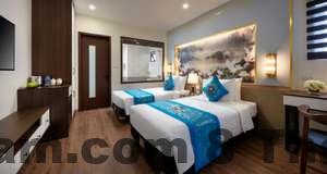 Một trong những phòng tại khách sạn Hacinco với thiết kế gọn gàng và sạch sẽ