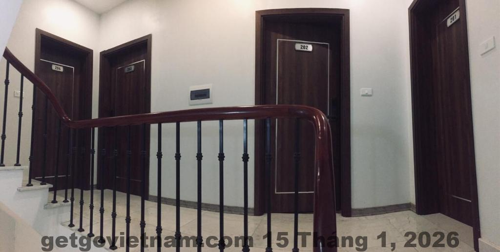 Phòng ngủ tại Munvilla Hotel với nội thất đơn giản, tập trung công năng