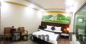 Quầy lễ tân nhỏ gọn tại Nhà nghỉ Light Hotel Long Biên