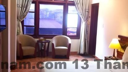 Phòng nghỉ tại khách sạn Huy Hoàng, không gian sáng sủa, đầy đủ tiện nghi cơ bản