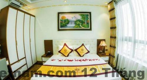 Phòng ngủ tiêu chuẩn tại BACNINH HARMONY HOTEL với nội thất gỗ đơn giản