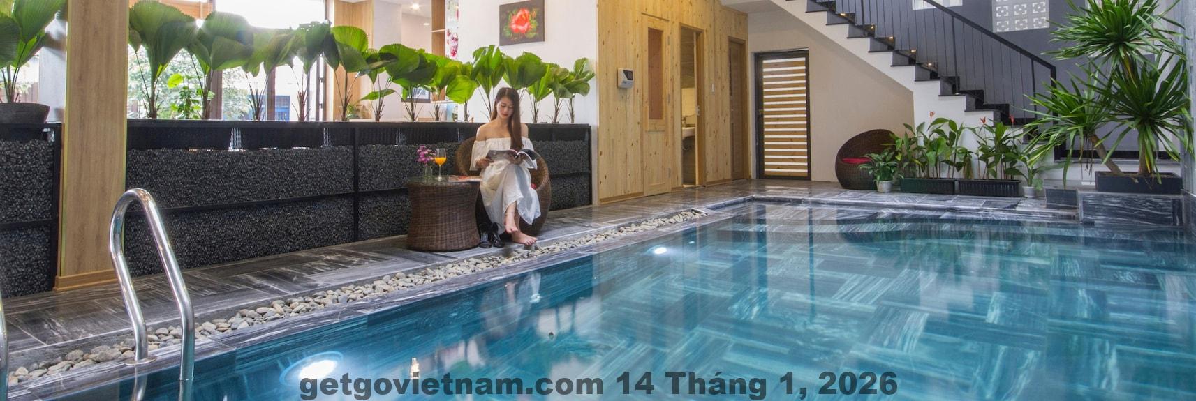 Phòng nghỉ tại King House Villa Hotel, không gian rộng rãi, thiết kế đơn giản nhưng thoải mái.