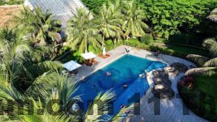 Phòng ngủ Nhà Nghỉ Hảo Thắm với nội thất đơn giản, gọn gàng và sạch sẽ