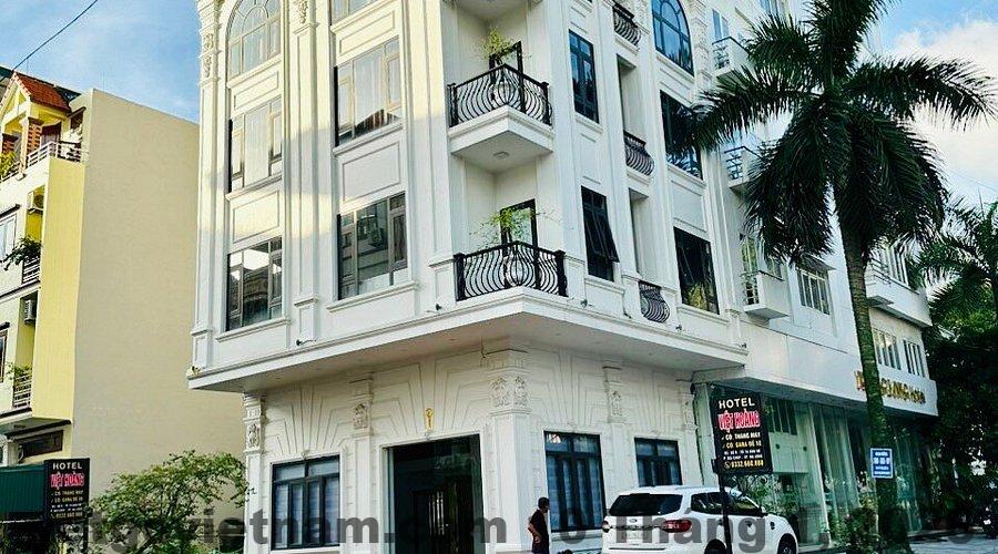 Nhà Nghỉ Cửu Long Hoàng Mai Review 2026: Có Nên Ở? 1 hotel building and street