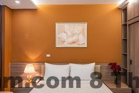 Không gian phòng ngủ khách sạn Moon Hotel 2 với nội thất đơn giản