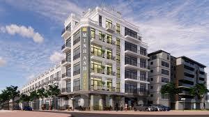 Quầy lễ tân nhỏ và nhân viên thân thiện tại Blue Hanoi Inn Hotel