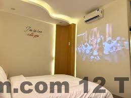 Phòng ngủ tại Star Night Hotel & Apartment 2 với giường lớn và nội thất hiện đại