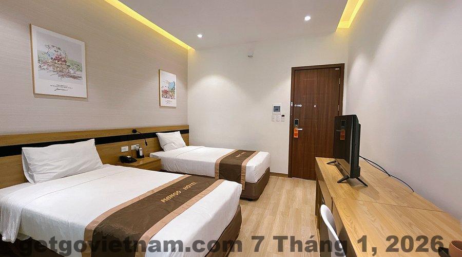 Phòng twin tại Khách Sạn Cây Xoài với thiết kế đơn giản, gọn gàng